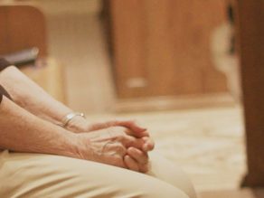 A sister sits in the chapel for prayer during a time of uncertainty.