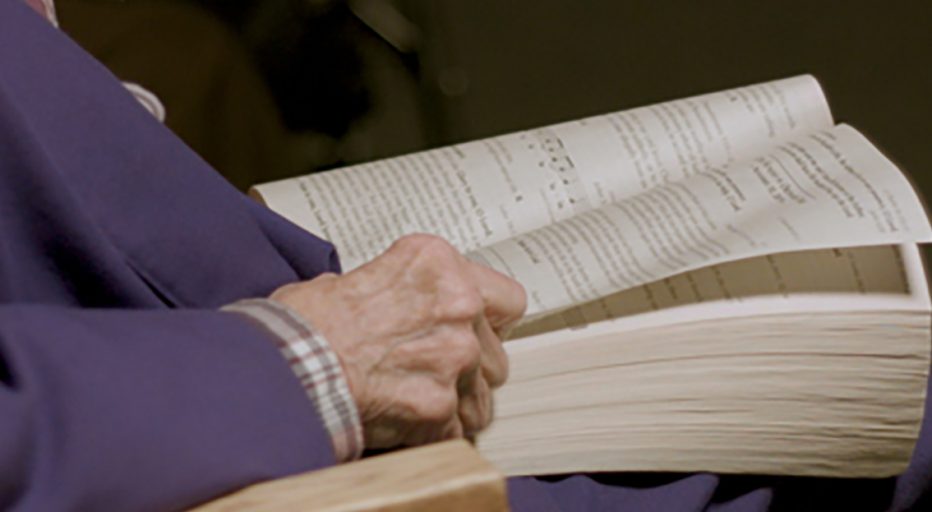 Sister praying for peace with a bible