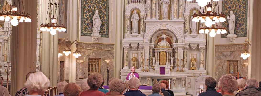 Parishoners worshipping at the beautiful St Joseph Historic Chapel on Layton Blvd.