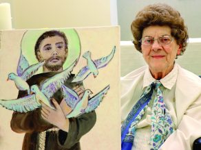 Sister Gwen Floryance with a painting she made of St. Francis of Assisi